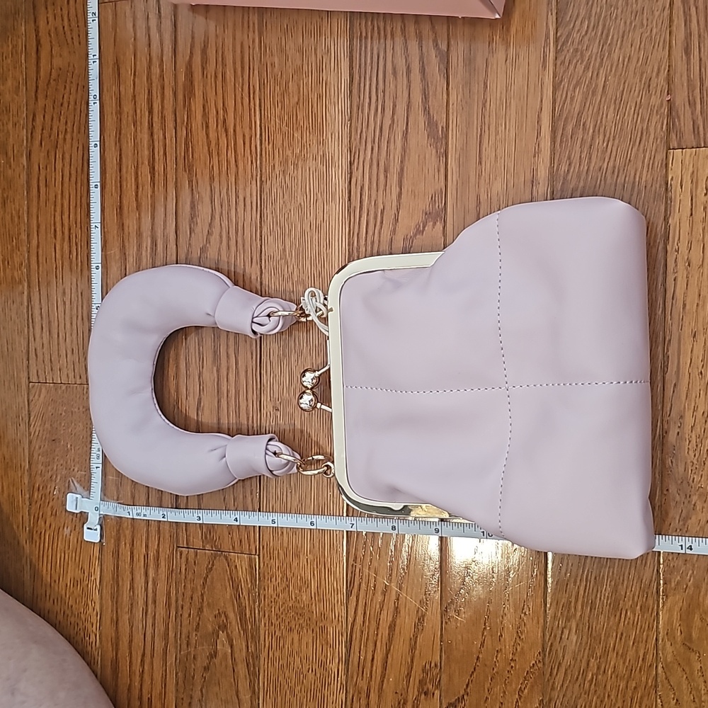 Adorable wrist/shoulder bag.